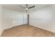 Bedroom with closet, ceiling fan and wood-look floors at 1112 67Th Nw St, Bradenton, FL 34209