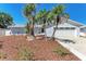 Inviting single-story home with lush landscaping and a two-car garage, radiating curb appeal at 1112 67Th Nw St, Bradenton, FL 34209