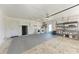 Spacious garage with laundry area, storage, and carpet remnant on the floor at 1112 67Th Nw St, Bradenton, FL 34209