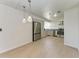 Bright kitchen features stainless steel appliances, modern cabinets and countertops, plus stylish pendant lighting at 1112 67Th Nw St, Bradenton, FL 34209