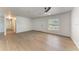Expansive living room with sleek floors, neutral paint, a modern ceiling fan, and ample natural light at 1112 67Th Nw St, Bradenton, FL 34209