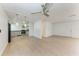 Open floor plan living room with bright floors and access to the kitchen at 1112 67Th Nw St, Bradenton, FL 34209