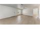 Spacious living room with stylish floors, a modern ceiling fan, and abundant natural light from the window at 1112 67Th Nw St, Bradenton, FL 34209