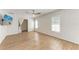 Spacious main bedroom features wood floors, ceiling fan, walk-in closet, and natural light at 1112 67Th Nw St, Bradenton, FL 34209