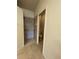 Clean bathroom featuring tiled floors, a tiled walk-in shower, and a toilet in a separate area at 11331 Bertolini Dr, Venice, FL 34292