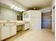 Spacious primary bathroom featuring dual sinks, vanity, and a large tiled walk-in shower at 11331 Bertolini Dr, Venice, FL 34292