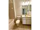Full bathroom with a tiled tub and shower combination, vanity, and a toilet at 11331 Bertolini Dr, Venice, FL 34292