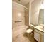Full bathroom with a tiled tub and shower combination, toilet, vanity and grab bar at 11331 Bertolini Dr, Venice, FL 34292