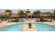 Beautiful clubhouse and outdoor pool area with fountain for community enjoyment at 11331 Bertolini Dr, Venice, FL 34292
