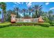 Welcome to Venetian Falls with manicured landscaping and attractive signage at 11331 Bertolini Dr, Venice, FL 34292