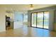 Open concept kitchen with island bar, and beautiful water views at 11331 Bertolini Dr, Venice, FL 34292