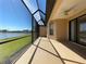 Spacious screened lanai perfect for outdoor relaxation with ceiling fan and lake views at 11331 Bertolini Dr, Venice, FL 34292