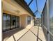 Screened patio with a ceiling fan offers an outdoor relaxation space at 11331 Bertolini Dr, Venice, FL 34292