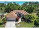 Picturesque aerial view of a well-maintained house showcasing its roof and landscaping at 11419 Pine Lilly Pl, Lakewood Ranch, FL 34202