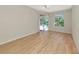 Bedroom with sliding doors to screened lanai and pool view at 11419 Pine Lilly Pl, Lakewood Ranch, FL 34202