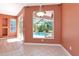 Dining area showcasing a window view of a sparkling pool and lanai at 11419 Pine Lilly Pl, Lakewood Ranch, FL 34202
