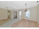 Spacious dining room showcasing wood and tile floors with natural lighting at 11419 Pine Lilly Pl, Lakewood Ranch, FL 34202