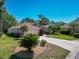 Inviting home with a 2-car garage, beautiful landscaping, and a well-maintained lawn that adds to the appeal at 11419 Pine Lilly Pl, Lakewood Ranch, FL 34202
