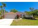 Charming single-story home boasting a well-manicured lawn and mature landscaping that enhances the curb appeal at 11419 Pine Lilly Pl, Lakewood Ranch, FL 34202