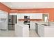 Modern, updated kitchen with stainless appliances and ample storage space at 11419 Pine Lilly Pl, Lakewood Ranch, FL 34202