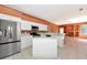 Full kitchen view with an island, stainless steel appliances, and stylish cabinets at 11419 Pine Lilly Pl, Lakewood Ranch, FL 34202