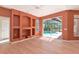 Open living space featuring sliding glass doors to a screened pool area at 11419 Pine Lilly Pl, Lakewood Ranch, FL 34202