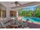Inviting screened-in pool area with a covered patio and outdoor seating at 11419 Pine Lilly Pl, Lakewood Ranch, FL 34202