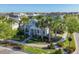Real estate showcasing the neighborhood with palm trees, manicured lawns, and lush foliage at 11717 Blue Hill Trl, Lakewood Ranch, FL 34211