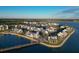 Gorgeous aerial view of waterfront community with modern architecture, scenic lake, and walking bridge at 11717 Blue Hill Trl, Lakewood Ranch, FL 34211
