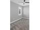 Standard bedroom with gray carpet, light gray walls, ceiling fan and a white window at 11717 Blue Hill Trl, Lakewood Ranch, FL 34211