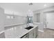 Bright open-concept living space with an eat-in kitchen island and lots of natural light at 11717 Blue Hill Trl, Lakewood Ranch, FL 34211