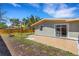 Backyard featuring a patio, lawn, and shade structure at 1200 74Th N St, St Petersburg, FL 33710