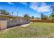 Lush backyard provides ample space for outdoor activities, complemented by a well-maintained lawn and wooden fence at 1200 74Th N St, St Petersburg, FL 33710