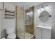 Updated bathroom features a tiled shower with glass door and modern fixtures at 1200 74Th N St, St Petersburg, FL 33710