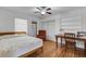Cozy bedroom featuring hardwood floors, desk space and natural light from the window at 1200 74Th N St, St Petersburg, FL 33710