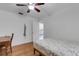 Bright bedroom with hardwood floors and ceiling fan at 1200 74Th N St, St Petersburg, FL 33710