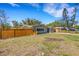 The property features a manicured front lawn, mature trees, and a welcoming facade at 1200 74Th N St, St Petersburg, FL 33710
