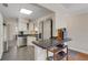 Kitchen featuring stainless steel appliances, white cabinetry, and a tiled backsplash at 1200 74Th N St, St Petersburg, FL 33710