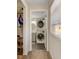 Convenient laundry area with a stacked washer and dryer, storage, and natural light at 1200 74Th N St, St Petersburg, FL 33710
