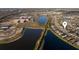Beautiful aerial view of a lakeside community with well-maintained homes and lush landscaping near a school at 12307 Blue Hill Trl, Bradenton, FL 34211
