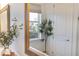 Bright bathroom with a large mirror, olive tree decoration, and bright natural lighting at 12307 Blue Hill Trl, Bradenton, FL 34211