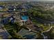 Aerial view of the community clubhouse, pool, playground, and basketball court at 12307 Blue Hill Trl, Bradenton, FL 34211