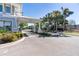Gated entrance to the property is beautifully landscaped with palm trees and manicured shrubbery at 12307 Blue Hill Trl, Bradenton, FL 34211
