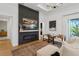 Bright living room with fireplace, flat screen tv, with comfortable seating at 12307 Blue Hill Trl, Bradenton, FL 34211