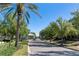 Street view of a well-maintained neighborhood with mature trees and beautifully landscaped lawns at 12307 Blue Hill Trl, Bradenton, FL 34211