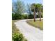 Serene outdoor path with trees and lush foliage, a tranquil setting at 12307 Blue Hill Trl, Bradenton, FL 34211