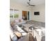 Cozy covered patio features neutral furniture, ceiling fan, and seamless indoor-outdoor flow at 12307 Blue Hill Trl, Bradenton, FL 34211