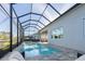 Inviting pool in screened-in patio with poolside seating provides backyard relaxation at 12307 Blue Hill Trl, Bradenton, FL 34211