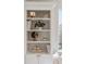 Built-in shelving unit displays books and decorative items, adding sophistication to the office at 12307 Blue Hill Trl, Bradenton, FL 34211