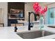 Kitchen sink and faucet with white countertops and flowers displayed at 12307 Blue Hill Trl, Bradenton, FL 34211